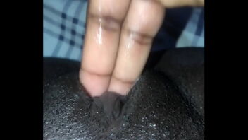 I have a black pussy and I am fingering it hard and I am cumming.