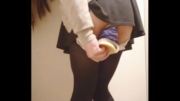 Young Japanese girl’s public dildo pleasure in the changing room