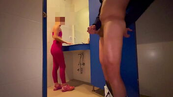 A woman at the gym catches me pleasuring myself in the locker room and helps me to orgasm.