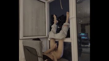 Young gay college boy shows off his orgasm in front of the window