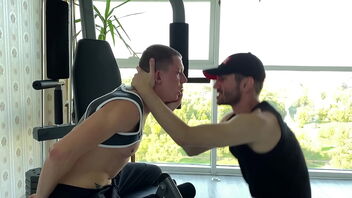 Muscle coach gets hot and steamy with his twink athlete on the exercise bike.