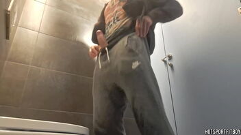 Amateur gay masturbation in public bathroom is risky.